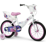 Bicicletta per bambini con rotelle Huffy in bianco e rosa con decorazioni di Minnie Mouse