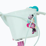 Cesta della bicicletta per bambina Huffy rosa con design di Minnie Mouse e manico bianco.
