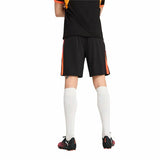 Pantaloncini calcio Puma uomo neri con dettagli arancioni, ideali per il gioco all'aperto