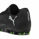 Scarpe da calcio Puma Future 8 uomo in nero con suola verde per prestazioni elevate sul campo