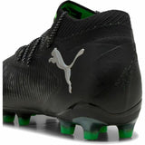 Scarpe da calcio Puma Future uomo nere con dettagli verdi e suola adatta per campi erbosi
