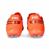 Scarpe da calcio Puma King adulte arancioni con suola in gomma per prestazioni elevate nel gioco